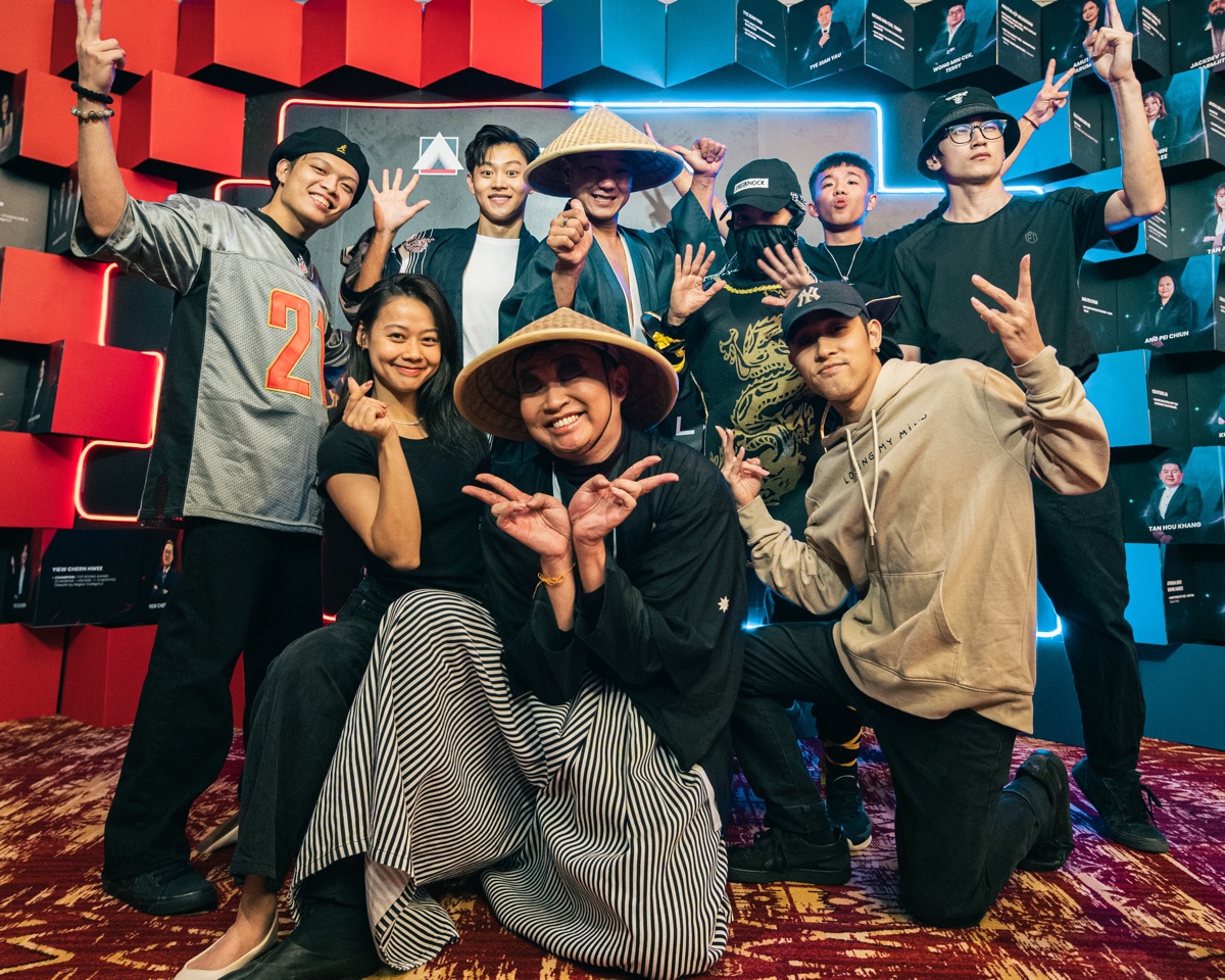 A dance crew posing together at an event